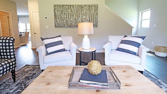 living room with dark hardwood / wood-style flooring