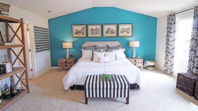 bedroom featuring carpet and lofted ceiling