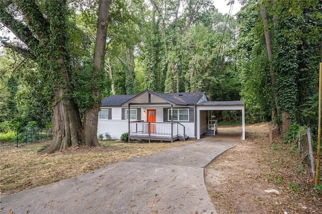 2437 Clarissa Dr NW, Atlanta, GA 30318 - ranch-style home with driveway and an attached carport
