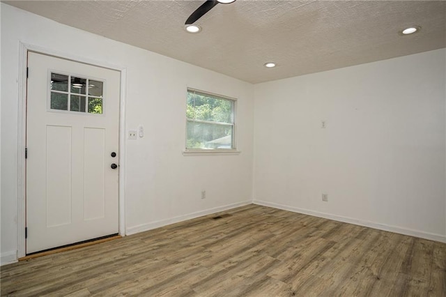 2437 Clarissa Dr NW, Atlanta, GA 30318 - entrance foyer with wood finished floors, a textured ceiling, and recessed lighting