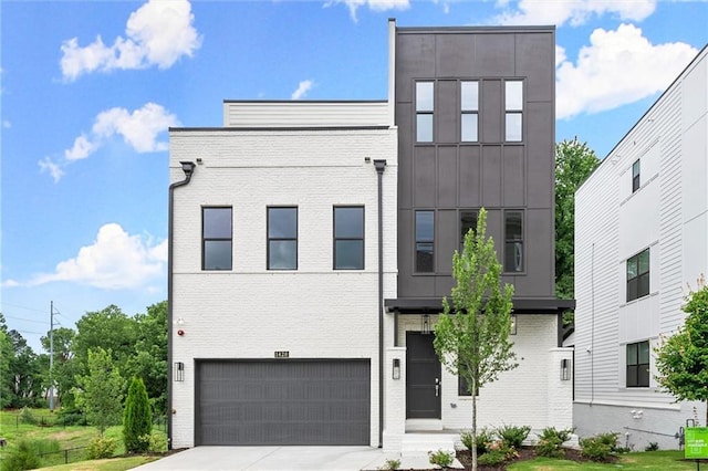 1420 Coretta Bnd, Atlanta, GA 30318 - contemporary home featuring an attached garage, brick siding, driveway, and board and batten siding