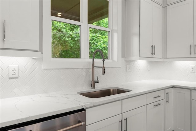 1420 Coretta Bnd, Atlanta, GA 30318 - kitchen featuring dishwasher, a sink, tasteful backsplash, white cabinets, and light stone countertops