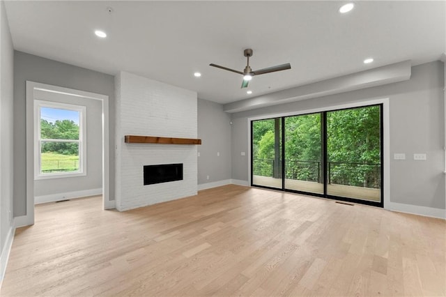1420 Coretta Bnd, Atlanta, GA 30318 - unfurnished living room featuring ceiling fan, light wood-style floors, baseboards, a fireplace, and recessed lighting