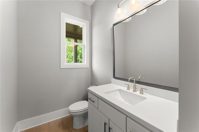 1420 Coretta Bnd, Atlanta, GA 30318 - half bath featuring baseboards, vanity, toilet, and wood finished floors