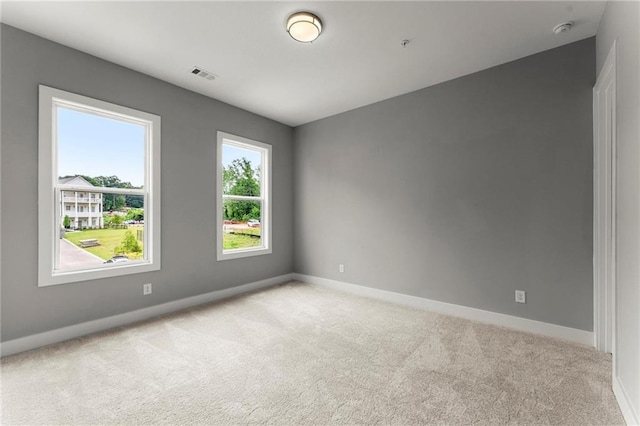 1420 Coretta Bnd, Atlanta, GA 30318 - empty room featuring light carpet, baseboards, and a smoke detector