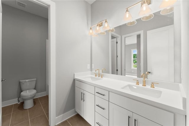 1420 Coretta Bnd, Atlanta, GA 30318 - full bath featuring double vanity, toilet, baseboards, and tile patterned flooring