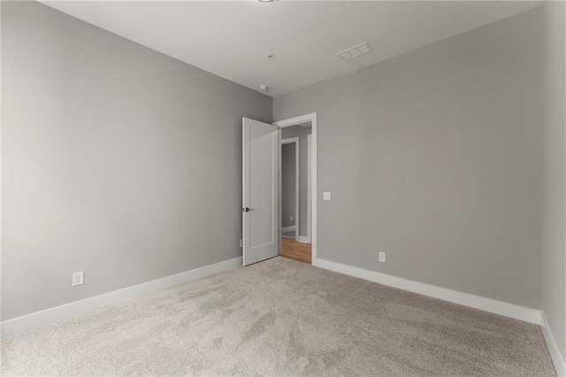 1420 Coretta Bnd, Atlanta, GA 30318 - spare room featuring light colored carpet and baseboards