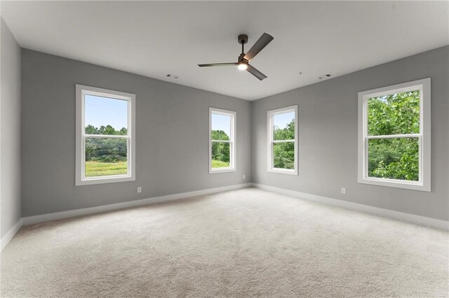 1420 Coretta Bnd, Atlanta, GA 30318 - carpeted spare room with plenty of natural light, baseboards, and a ceiling fan