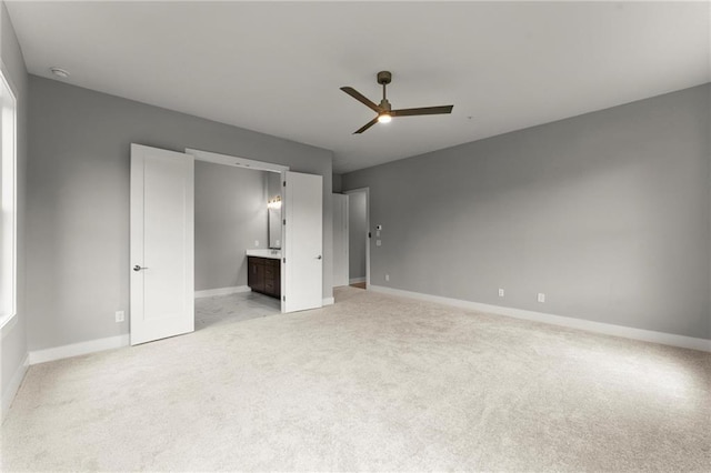 1420 Coretta Bnd, Atlanta, GA 30318 - unfurnished bedroom with baseboards, light carpet, ensuite bathroom, and a ceiling fan