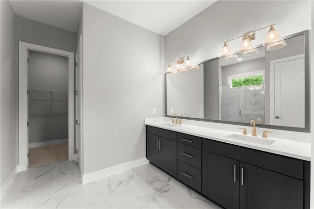 1420 Coretta Bnd, Atlanta, GA 30318 - bathroom featuring marble look tile flooring, baseboards, double vanity, a marble finish shower, and a spacious closet