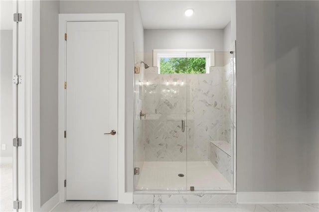1420 Coretta Bnd, Atlanta, GA 30318 - bathroom featuring marble finish flooring, a marble finish shower, and baseboards