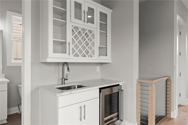 1420 Coretta Bnd, Atlanta, GA 30318 - indoor wet bar with wine cooler, light wood-type flooring, and baseboards