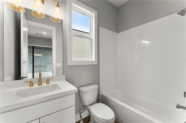 1420 Coretta Bnd, Atlanta, GA 30318 - bathroom featuring toilet, vanity, and tub / shower combination