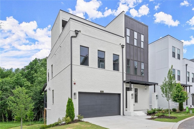 1420 Coretta Bnd, Atlanta, GA 30318 - view of front facade featuring brick siding, a garage, and concrete driveway