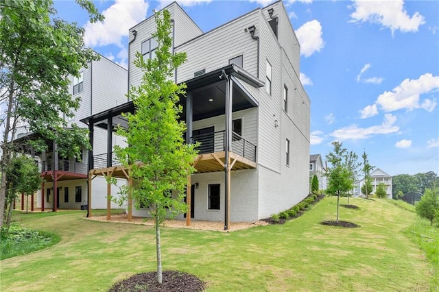 1420 Coretta Bnd, Atlanta, GA 30318 - rear view of property with a yard and a balcony
