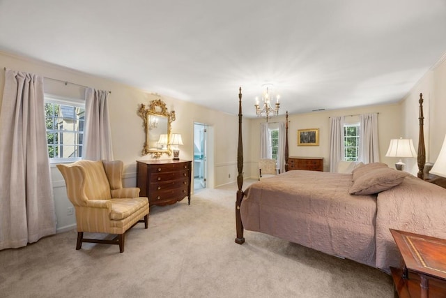 carpeted bedroom with an inviting chandelier