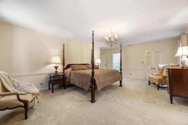 carpeted bedroom featuring an inviting chandelier and a closet