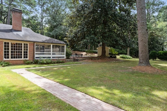 view of yard with a sunroom