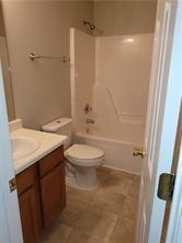 1752 Spring Hill Cv, Lithonia, GA 30058 - bathroom with vanity, toilet, and shower / bath combination
