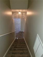 1752 Spring Hill Cv, Lithonia, GA 30058 - staircase with baseboards and brick flooring