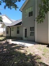 1752 Spring Hill Cv, Lithonia, GA 30058 - back of property with a patio area