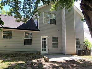 1752 Spring Hill Cv, Lithonia, GA 30058 - back of house with a patio area and central AC unit