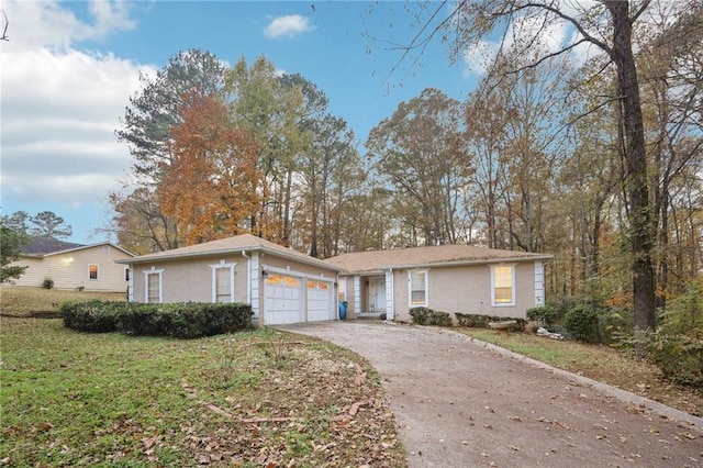 ranch-style house featuring stucco siding, an attached garage, concrete driveway, and a front lawn