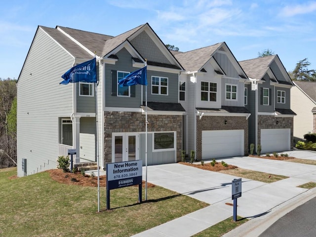 10 Rustin Rdg, Dahlonega, GA 30533 - view of front of property with a garage, stone siding, driveway, board and batten siding, and a front yard