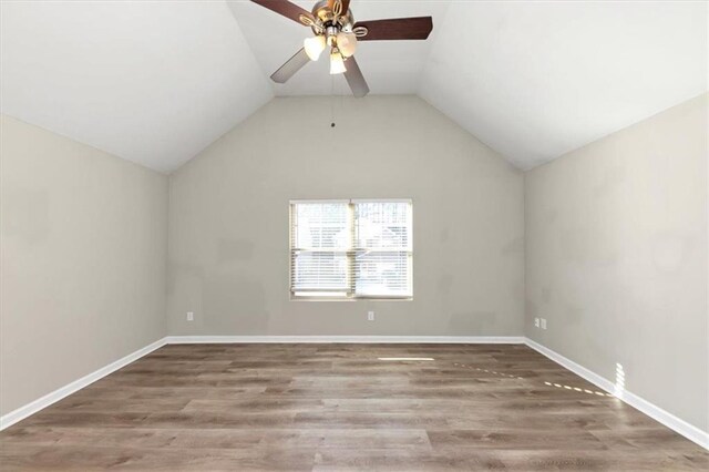 bedroom featuring lofted ceiling, ceiling fan, and hardwood / wood-style flooring