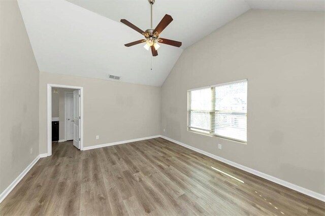 unfurnished room featuring ceiling fan, light hardwood / wood-style flooring, and lofted ceiling