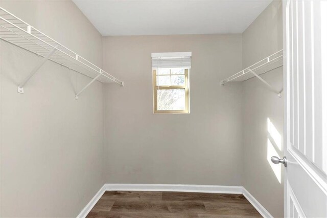 washroom featuring washer hookup, electric dryer hookup, and hardwood / wood-style flooring