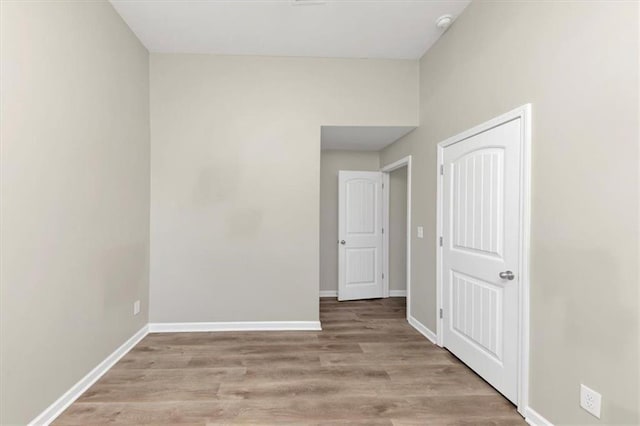 unfurnished room featuring light hardwood / wood-style floors