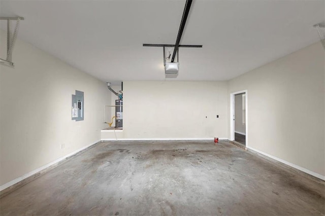 garage with a garage door opener, gas water heater, and electric panel