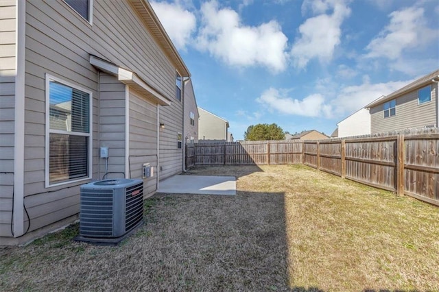 view of yard featuring cooling unit and a patio area