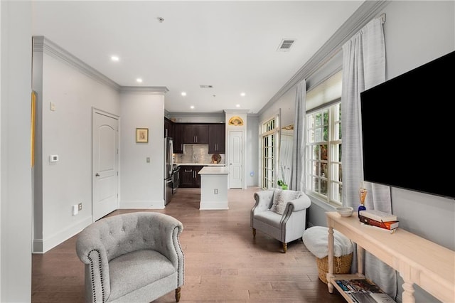1055 Piedmont Ave NE Unit 106, Atlanta, GA 30309 - living area featuring ornamental molding, light wood finished floors, and recessed lighting