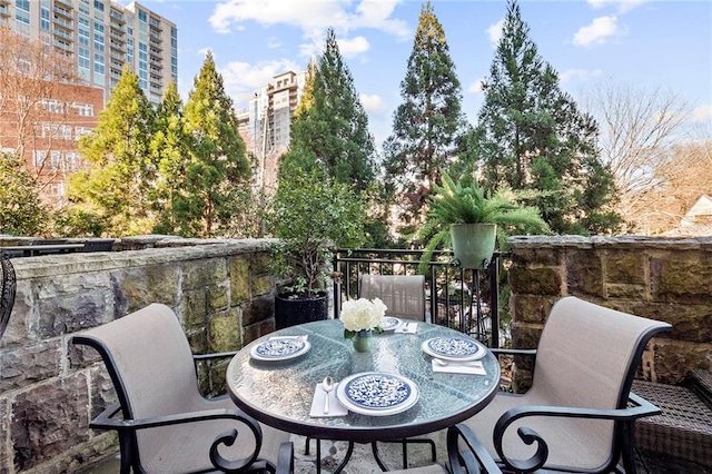 1055 Piedmont Ave NE Unit 106, Atlanta, GA 30309 - view of patio featuring outdoor dining area