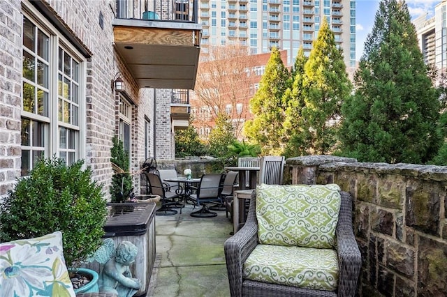 1055 Piedmont Ave NE Unit 106, Atlanta, GA 30309 - view of patio featuring outdoor dining area
