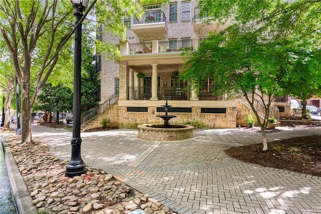 1055 Piedmont Ave NE Unit 106, Atlanta, GA 30309 - view of front of home with brick siding and stairway