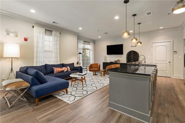 1055 Piedmont Ave NE Unit 106, Atlanta, GA 30309 - living area featuring crown molding, wood finished floors, and recessed lighting