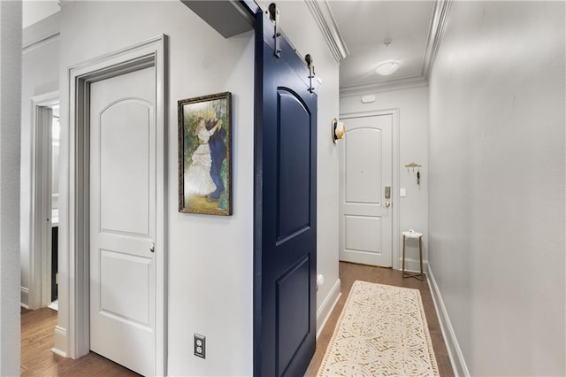 1055 Piedmont Ave NE Unit 106, Atlanta, GA 30309 - hall with ornamental molding, wood finished floors, and a barn door