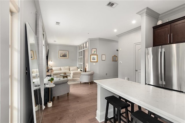 1055 Piedmont Ave NE Unit 106, Atlanta, GA 30309 - kitchen with freestanding refrigerator, crown molding, dark brown cabinetry, dark wood-style flooring, and recessed lighting