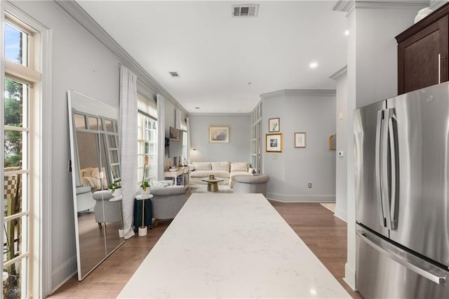 1055 Piedmont Ave NE Unit 106, Atlanta, GA 30309 - living area with ornamental molding, plenty of natural light, light wood-type flooring, and recessed lighting