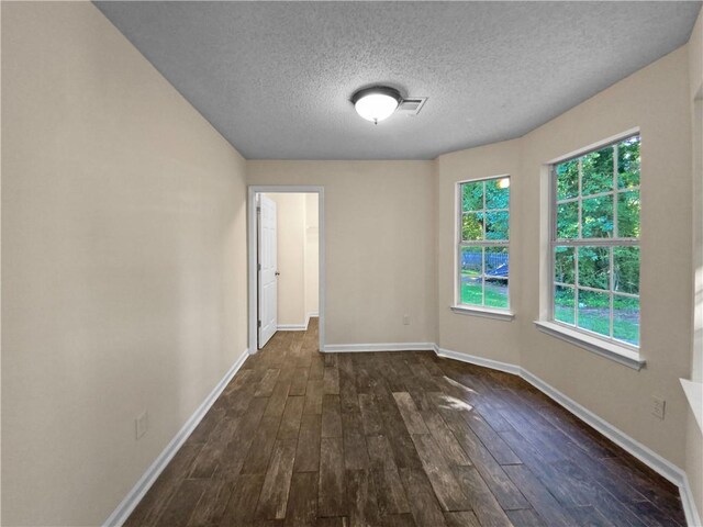 4024 Waldrop Hills Dr, Decatur, GA 30034 - spare room featuring dark hardwood / wood-style floors and a textured ceiling