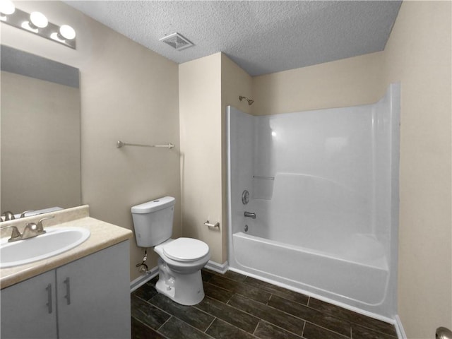 4024 Waldrop Hills Dr, Decatur, GA 30034 - full bathroom featuring vanity, shower / washtub combination, a textured ceiling, and toilet