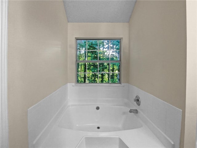 4024 Waldrop Hills Dr, Decatur, GA 30034 - bathroom with a bathing tub and a textured ceiling