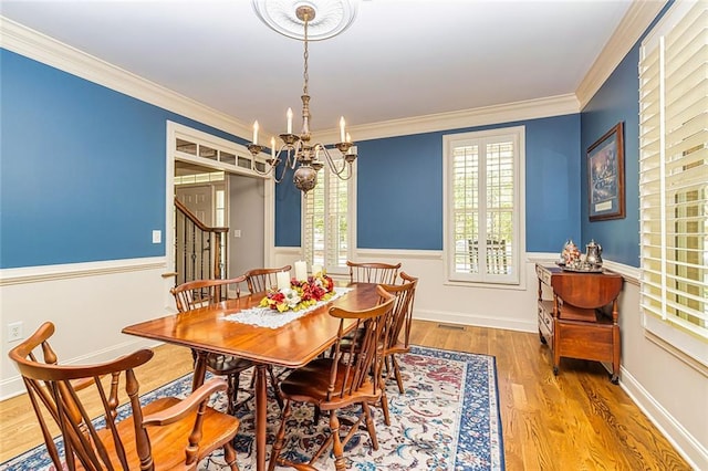 20 Jasmine Ct, Newnan, GA 30265 - dining room with a chandelier, plenty of natural light, crown molding, and wood finished floors