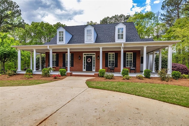 20 Jasmine Ct, Newnan, GA 30265 - view of front of property with brick siding, covered porch, and a front yard
