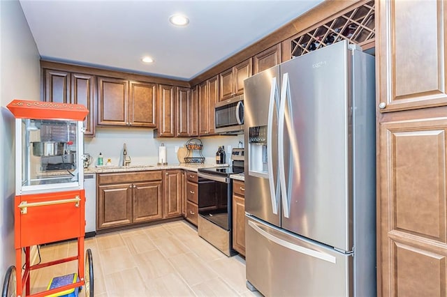 20 Jasmine Ct, Newnan, GA 30265 - kitchen featuring stainless steel appliances, recessed lighting, and brown cabinets