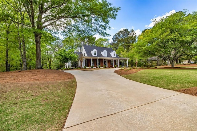 20 Jasmine Ct, Newnan, GA 30265 - view of front of house featuring covered porch, concrete driveway, and a front lawn