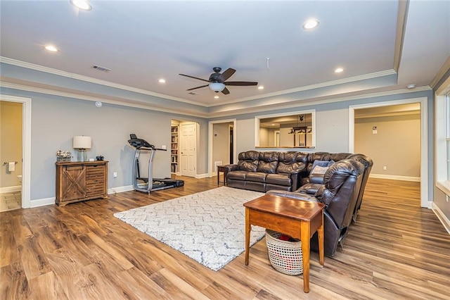 20 Jasmine Ct, Newnan, GA 30265 - living area featuring crown molding, a ceiling fan, wood finished floors, recessed lighting, and a raised ceiling